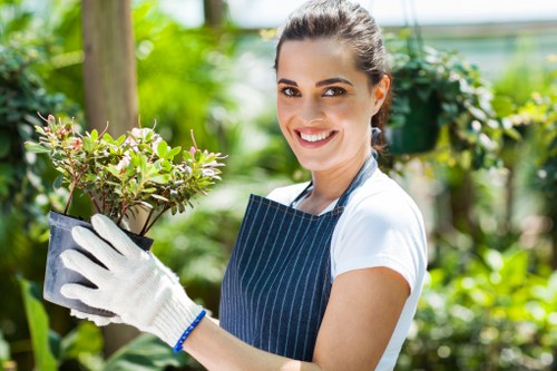 Gardening staff wearing PPE while maintaining a garden